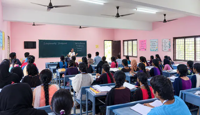 Nursing students seated in a spacious classroom